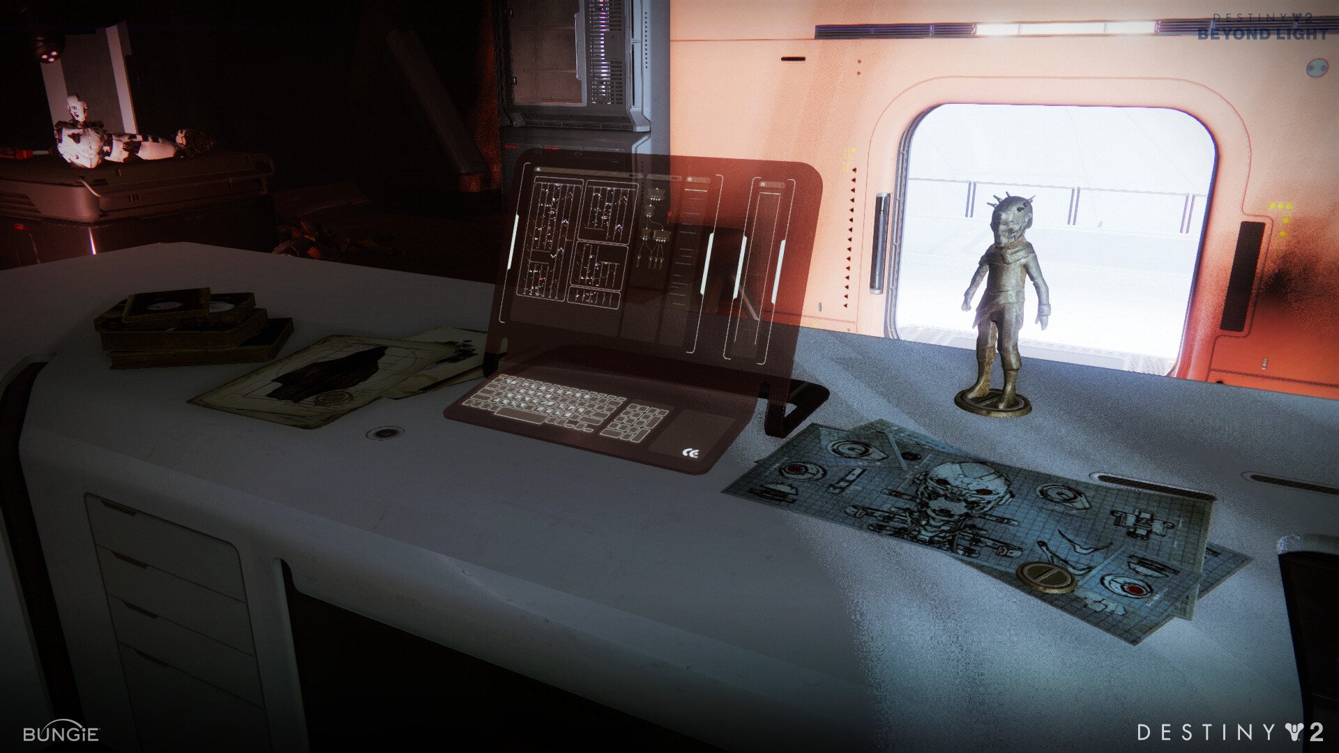 Model of Clovis-1 and drawings of Clarity on Clovis' desk.